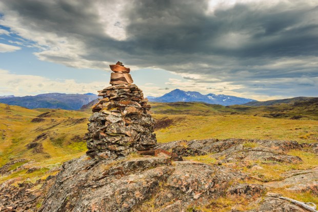 Landscape with a cairn in center of frame.